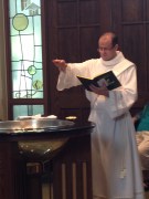 Deacon David during a baptism